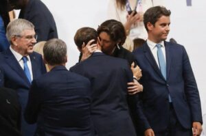 Macron Kisses Sports Minister Amélie Oudéa-Castéra, Sparking Controversy