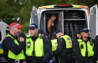 UK police arrest 6 after protesters descend on a hotel housing asylum seekers A town on the outskirts of London was rocked by protesters who descended on a hotel housing asylum seekers for the second time in four days on Sunday night, amid anger about a migrant accused of sexual assault. Police in the town of Epping said they arrested six people on Sunday, including four suspected of involvement in “violent disorder” during the previous demonstration on Thursday. Officers patrolled the area around the Bell Hotel throughout the night after issuing an order for the crowds to disperse. Chanting “Save our kids” and “Send them home,” more than 100 demonstrators, some brandishing British flags, gathered outside the hotel Sunday evening. The protests escalated as night fell, with flares and projectiles thrown toward police vans blocking the entrance. Police escorted a counter-protester from the area after demonstrators surrounded her. “Disappointingly we have seen yet another protest, which begun peacefully, escalate into mindless thuggery with individuals again hurting one of our officers and damaging a police vehicle,” Chief Superintendent Simon Anslow of the Essex Police said in a statement. “For anyone who thinks we will tolerate their thuggery – think again.” The protests come amid escalating tensions over the rising number of asylum seekers who are being housed at government expense in hotels around the country. Those pressures flared into days of rioting last month in Northern Ireland after two teenagers were arrested on charges of sexual assault. Violent anti-immigrant protests spread throughout the UK last summer after social media users spread misinformation about the identity of the person who attacked a dance class in the northwestern town of Southport, killing three young girls. The attacker was a 17-year-old who was born in the UK born in the UK to parents from Rwanda, not an asylum seeker as had been rumored. Prime Minister Keir Starmer condemned last year’s riots as “far-right thuggery” as police intervened to stop the violence and expedited the sentencing of those convicted of taking part. Before Sunday’s protests in Epping, local police issued an order that allowed them to force demonstrators to remove face coverings. The later issued an order for the demonstrators to leave the area around the hotel. That dispersal order remained in effect until 4 a.m. Monday. The demonstration came after eight police officers were injured on Thursday after a peaceful protest outside the hotel escalated into violence. Police blamed the violence on people from outside the community who “arrived at the scene intent on causing trouble.” Four of those detained on Sunday were arrested in connection with events that happened during the initial protest, police said. A fifth was arrested on suspicion of causing criminal damage to a police car, while the sixth was arrested for being equipped to cause criminal damage. The protests began after a 38-year-old asylum seeker was charged with sexual assault after allegedly attempting to kiss a 14-year-old girl. The man is being held without bail after he had his first court appearance on July 10. He denies the charges. “We don’t take sides, we arrest criminals and we have a duty to ensure no-one is hurt — plain and simple,″ Anslow said. “I know the people of Essex know what we’re about so I know they won’t believe the rubbish circulating online that is designed to do nothing more than inflame tensions and trouble.’’ Epping Forest District Council, which provides local government services in the area, condemned the violence but said it had long opposed the central government’s decision to use the Bell Hotel to house asylum seekers. “We have consistently shared concerns with the Home Office that the Bell Hotel is an entirely unsuitable location for this facility and should close,” council Leader Chris Whitbread said in a statement last week. “We continue to press Home Office officials for the immediate closure of the site and are encouraged that our local MPs are now actively supporting our call.”