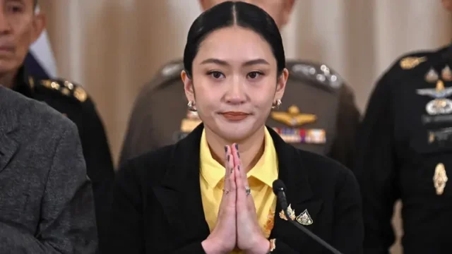 Protesters in Bangkok demand resignation of suspended PM Shinawatra after deadly conflict