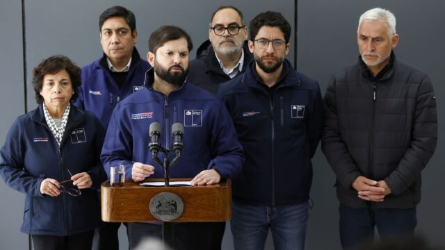 Rescue workers in Chile find the body of one of 5 miners trapped in a copper mine