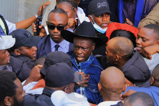 Despite the commotion, Gachagua eventually made it to his vehicle and popped out of the sunroof to wave at the ecstatic crowds. The return of President William Ruto’s fiercest critic comes after a 43-day tour of the U.S., where he held engagements with the Kenyan diaspora while popularizing his new political vehicle, the Democratic Change Party (DCP). His homecoming had been highly publicized, with many linking it to the upcoming by-elections in which DCP has fielded candidates. DCP deputy party leader Cleophas Malala had earlier urged supporters to flock to JKIA, framing the reception as more than a mere welcome. “This is not just a welcome—it is a statement to the world that Kenya belongs to her people,” Malala declared, while warning the government against any attempt to arrest Gachagua upon arrival. The calls drew a sharp response from the State. Speaking in Murang’a during the Jukwaa la Usalama forum, Interior Cabinet Secretary, flanked by Inspector General of Police Douglas Kanja, dismissed the hype around Gachagua’s landing. “There are so many people landing in Kenya every day, so I don’t know why we should be worried when one person is landing,” the CS remarked. He, however, warned Gachagua and his allies against fanning tensions through inflammatory remarks. “For the time he has been away, the country has been relatively peaceful,” the CS said, assuring that security agencies are on standby to deal with any disruptions. Gachagua’s return is set to test the delicate balance between his growing political movement and the government’s resolve to contain dissent ahead of looming electoral contests.