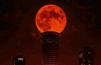 Blood moon shines in the evening sky Blood moon shines in the evening sky
