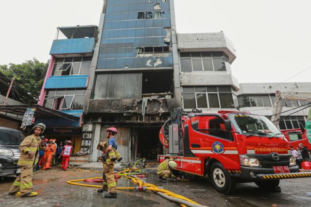 A fire in a building on Tuesday in Indonesia's capital killed at least 20 people, police said. Police said the fire started in the afternoon when a battery on the first floor of a seven-story office building in central Jakarta exploded and the fire spread to the upper levels. "As of now, 20 victims have been retrieved, consisting of five men and 15 women," Susatyo Purnomo Condro, the Central Jakarta police chief, told reporters, adding that one of those killed was a pregnant woman. Susatyo said most of the victims did not seem to suffer from burns and most likely died of asphyxiation. He said the bodies had been taken to the police hospital for autopsy. Firefighters are still scouring the scene to find more people possibly trapped inside the building, he said. "We are still collecting data, but for now, we are focusing on identifying the victims who have been found," he said. Susatyo said that firefighters were focused on cooling the building due to intense heat and thick smoke on several floors. Deadly fires are not uncommon in Indonesia where in 2023, at least 12 people were killed and 39 injured in eastern Indonesia after an explosion at a nickel-processing plant.